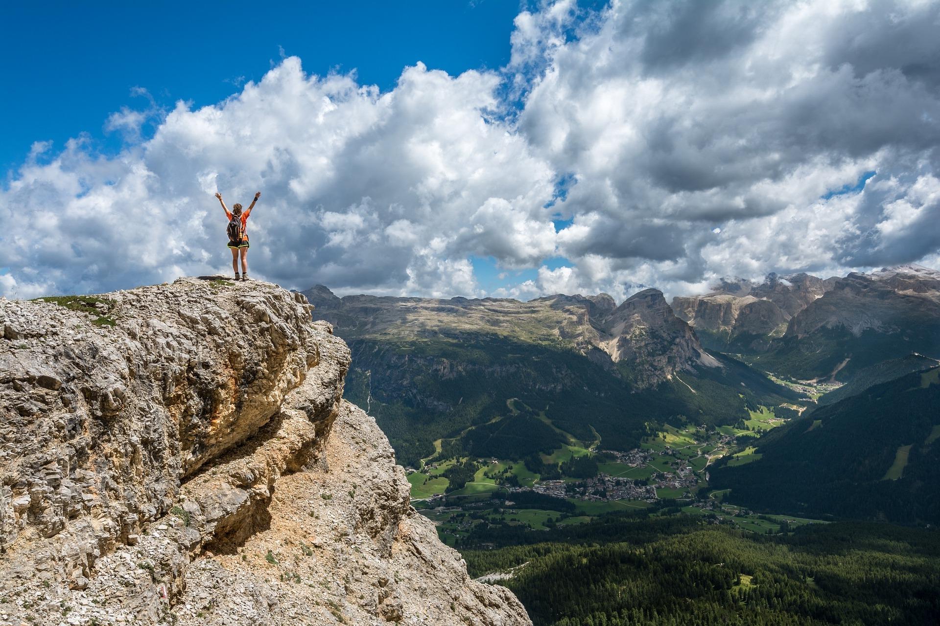 A hiker standing on top of a mountain